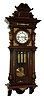 Germany, Vienna regulator, stained hardwood and walnut veneer case, architectural case with divided door, applied, carved split columns, removable carved crest, and applied stamped brass ornament, Roman numeral white enamel dial , pierced steel hands, brass 3 train, weight driven, 8 days, time and strike, movement, with grand sonnerie striking, brass pendulum with ebonized wooden rod, and 3 brass weights, c1910