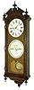 Ithaca Calendar Clock Co., Ithaca, N.Y., "No. 2 Bank" wall clock, 8 days, time and perpetual calendar, two weight driven movement in an oak case with two papered metal dials, dated 1889