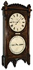 Seth Thomas Clock Co., Thomaston, Conn., "Office Calendar No. 5" wall clock, 8 days, time and perpetual calendar, weight driven movement in a walnut case with burled spandrels, presentation plaque to "Good Will Lodge No. 181 from the Independent Order of Foresters 1890," a Spencer, Mass. jeweler's label inside door and two painted metal dials, c1890
