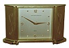 Chelsea Clock Co., Boston, for Black, Starr & Gorham, Inc., "Wisteria" model gold-plated brass 8 day desk clock, c1960.