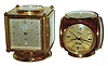 Clocks- 2 (Two): Imhof, Swiss-made swiveling case weather stations with top compass, clock, thermometer, barometer and hygrometer; one square brass with 8 day alarm and calendar clock; one red painted brass with Bucherer quartz clock; later 20th century