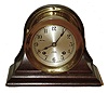 Chelsea Clock Co., Boston, 4" 8 day ship's bell striking marine clock in brass case with hinged bezel and mahogany cradle, #568341, c1952