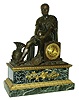 Ledure, Bronzier, Hemon, Hor., France, monumental figural mantel clock, the case featuring a large patinated figure of Hannibal among the ruins of Carthage, his sword and helmet at his feet, and surrounded by architectural fragments, the figure seated on the square clock case, gilt oak leaf and acorn wreath bezel with convex glass, signed Roman numeral gilt dial, blued steel Breguet style hands, on a stepped green marble base, the top section with gilt egg and dart molding, thje front mounted with a relief of a helmet, spear, and laurel fronds, the lower section with gilt bronze acanthus molding and oblong marble plinth, brass 8 days, time and strike, pendule a Paris movement signed "Hemon a Paris", and with silk thread suspension, c1820