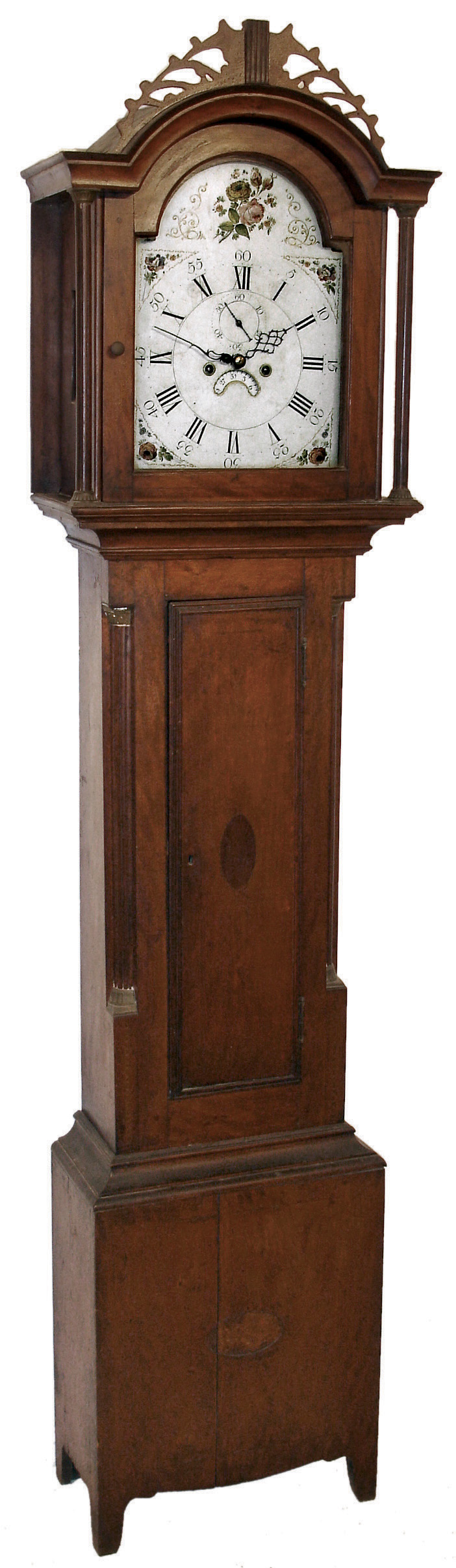 Unsigned New England tall clock, 8 days, time, strike and calendar, weight driven movement in a birch case with inlaid medallion on trunk door, fret work crest, reeded columns flanking hood door, reeded corner columns flanking trunk door and a painted iron dial, c1820 — Antique Clocks Price Guide