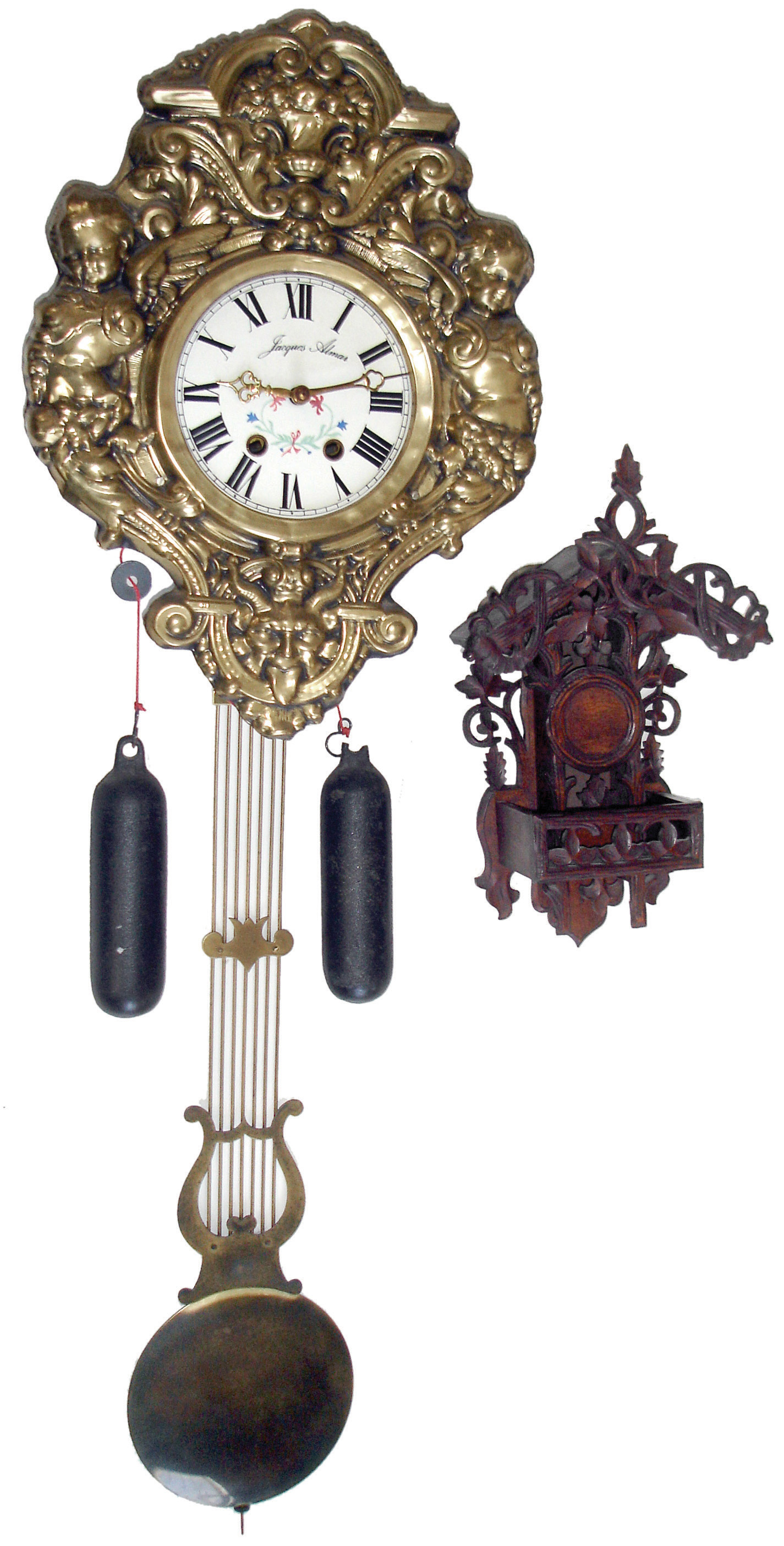 Clocks- 3 (Three) and Watch Holder, 20th century: (1) German reproduction small Morbier-style time and strike, weight driven, wall clock; (2) carved walnut hanging watch holder; (3) Horolovar Co., Bronxsville, New York, reproduction of the Briggs rotary pendulum timepiece, 8 days, bottom wind with glass dome, c1975; (4) Chinese modern reproduction rosewood, 8 days, time and strike, double fusee bracket clock, two-piece case, verge and crown wheel escapement, center seconds, late 20th century — Antique Clocks Price Guide
