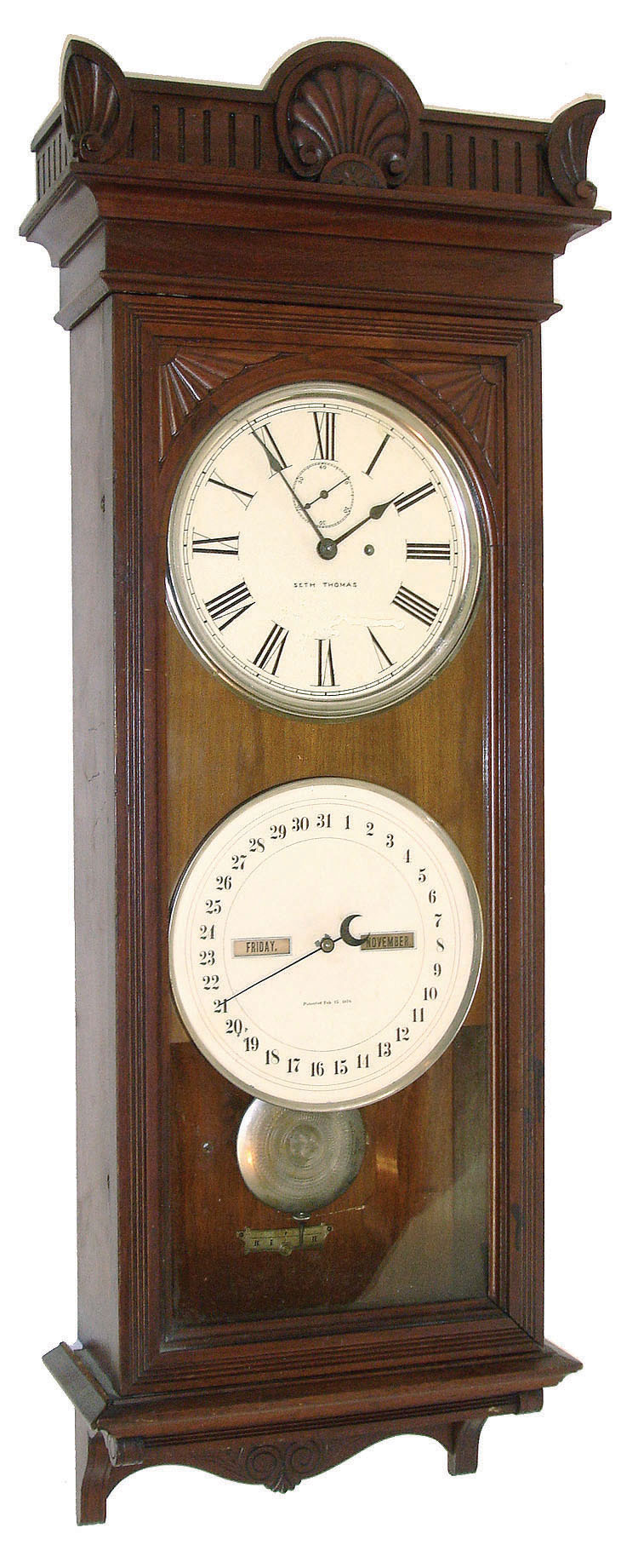 Seth Thomas Clock Co., Thomaston, Conn., ÓOffice Calendar No. 12Ò, wall clock, 8 days, time and calendar, weight driven movement in a walnut case with painted metal dials, date stamped on rear 1888 — Antique Clocks Price Guide