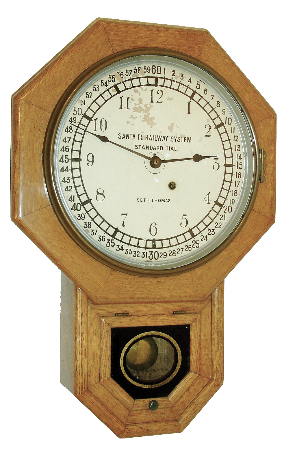 Seth Thomas Clock Co., Thomaston, Conn., ÒDrop Octagon 12 InchÓ wall hanging clock with an, 8 days, timepiece movement and Santa Fe RR dial in an oak case, c1902. — Antique Clocks Price Guide