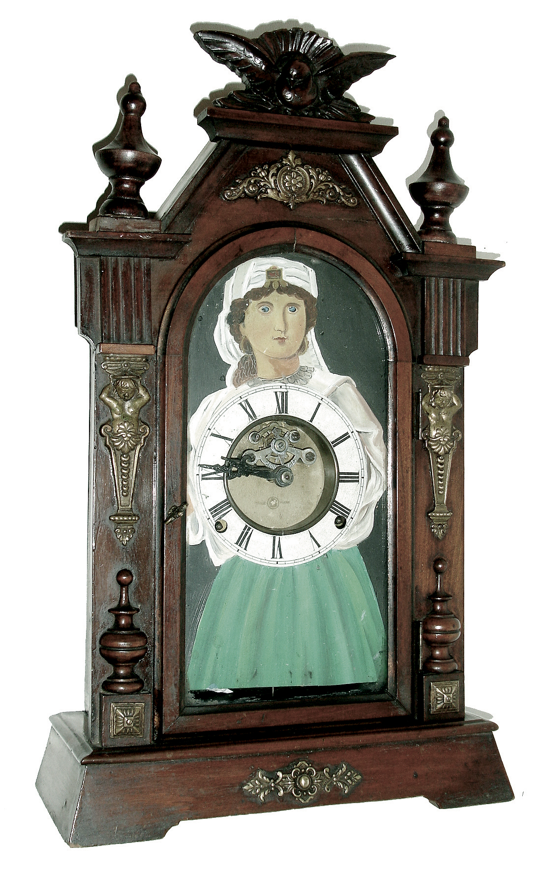 Japan, ÓAÒ on dial, probably Aichi of Nagoya, BLINKING EYE parlor clock, with typical open spring movement, this one with lever escapement, the balance showing on the dial, and with a hidden connection from the lever to the eyes that produces animation. The case of Germanic influence, with embossed brass caryatids and buttons, and surmounted by a spread wing bird, c1905 — Antique Clocks Price Guide
