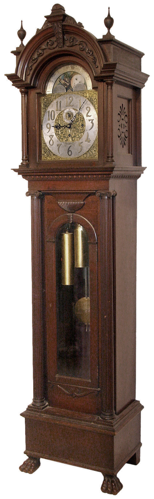 Tobey Furniture Co., Chicago, Illinois, tall case clock, 8 days, time, strike and chime on 5 tubes stamped Elite, three brass, weight driven, German Winterhalder &amp; Hofmeier movement in a mahogany case with full reeded Corinthian columns flanking trunk and hood, applied carvings on hood crest and trunk door, resting on paw feet with a, brass dial with silvered chapter ring, subsidiary seconds, moon phase and cast brass and etched corner spandrels and dial center, c1905 — Antique Clocks Price Guide