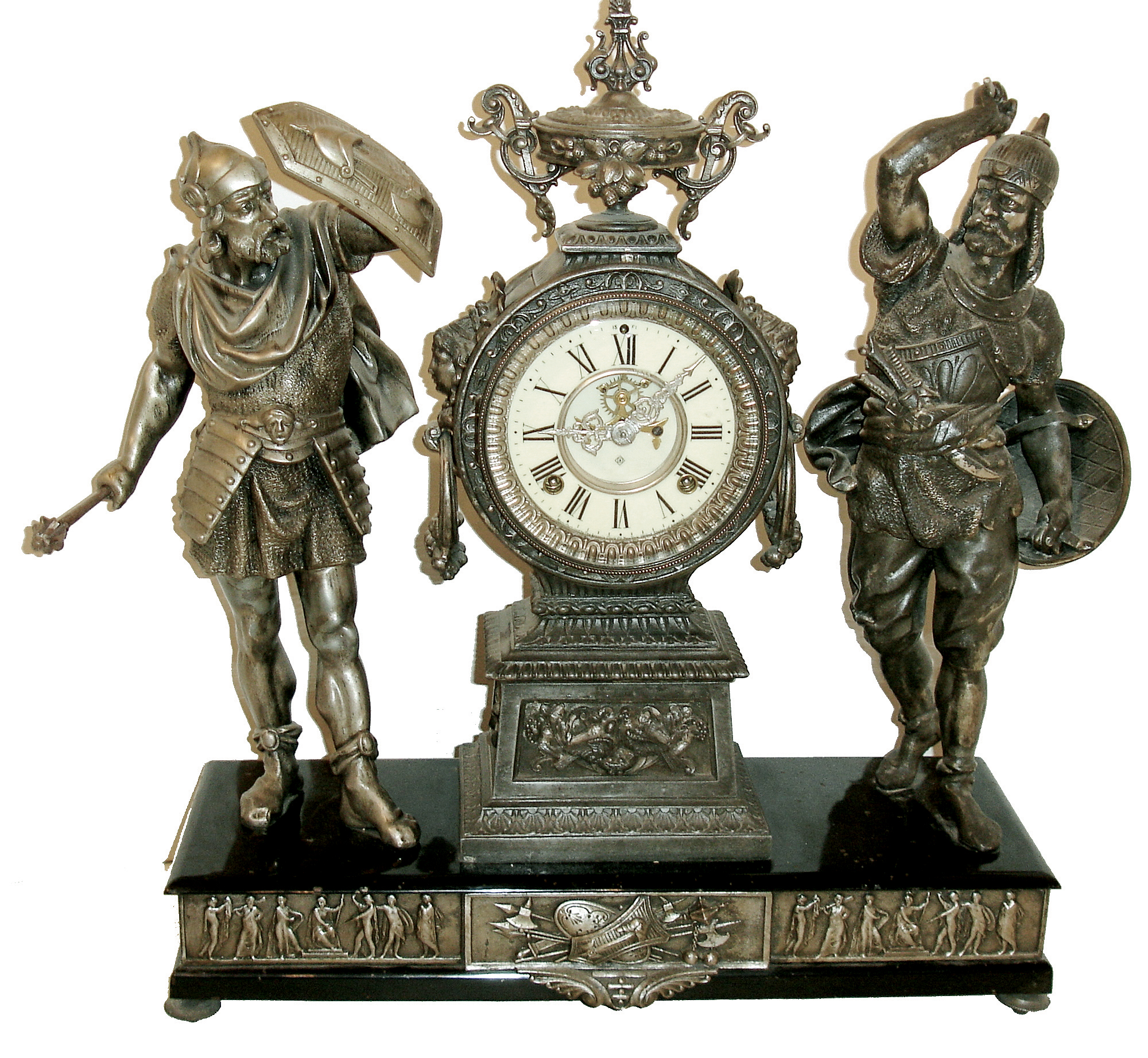 Ansonia Clock Co., New York, NY, ÒCombatantsÓ double statue figural shelf clock, 8 days, time and strike, spring driven movement with decorated back plate. Silver finished spelter case on enameled cast iron base with silver finished friezes around perimeter with cream enamel dial and open escapement, c1894 — Antique Clocks Price Guide