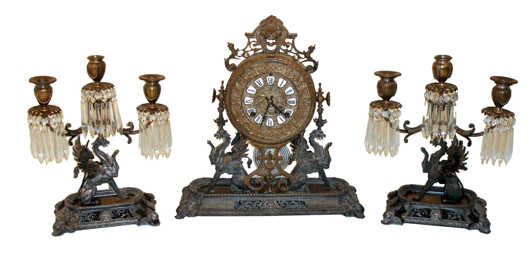 Ansonia Clock Co., New York, NY, three piece mantle clock set consisiting of the ÓRenaissanceÒ shelf clock with 8 days, spring driven, time and half hour strike movement and two ÓNo. 1062Ò matching candelabra, c1886. — Antique Clocks Price Guide