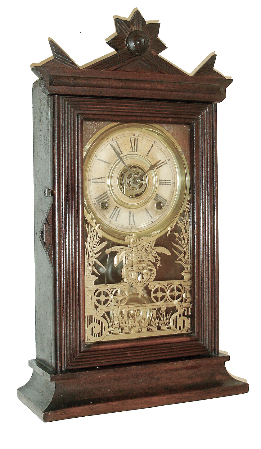 Clocks- 3 (Two) American: (1) E. Ingraham &amp; Co., Bristol, Conn., ÓAcmeÒ shelf clock in a walnut case with a spring driven, 8 days, time, strike and alarm movement, c1882; (2) Seth ThomasÕ Sons &amp; Co., New York, No. 5001 model time and bell strike candle stand clock, less dome (3) Ansonia Clock Co., Ansonia, Conn., ÓCoralÒ, 8 days, time and strike, spring brass movement crystal regulator mantel clock, c1914 — Antique Clocks Price Guide