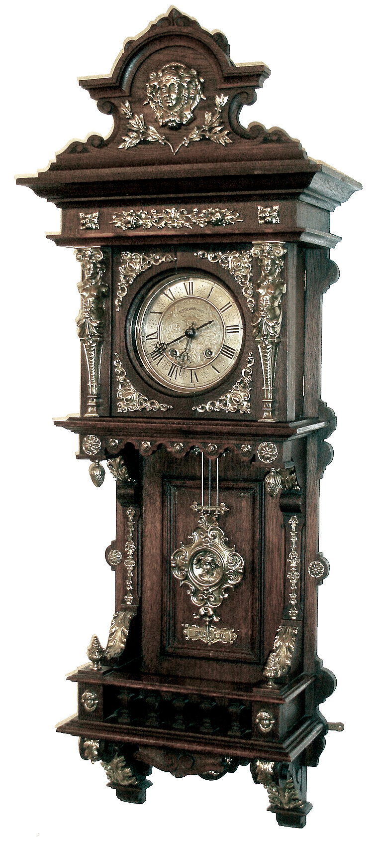 Lenzkirch, Germany, oak ÒFreischwingerÓ , with 34 pieces of polished brass trim, the fancy pendulum with a central bust, and crest with a facial casting of Diana with elaborate hair jewels. The dial flanked by two female caryatids, brass castings with good detail. The well made count wheel striking movement with strong Lenzkirch logo and serial Nr. 866,286 circa 1889. — Antique Clocks Price Guide