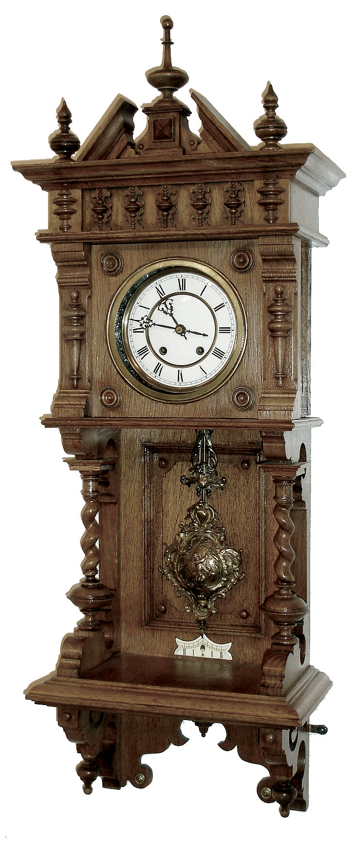 Lenzkirch, Germany, oak cased ÓFreischwingerÒ, most similar to model 622 that is illustrated in several publications. Note barley twist columns on either side of the open well. Using the desirable Angel -- winged cherub pendulum that is illustrated in Ó150 Jahre Lenzkircher UhrenÒ, page 136. Serial Nr. 1,037,868, circa 1894. — Antique Clocks Price Guide