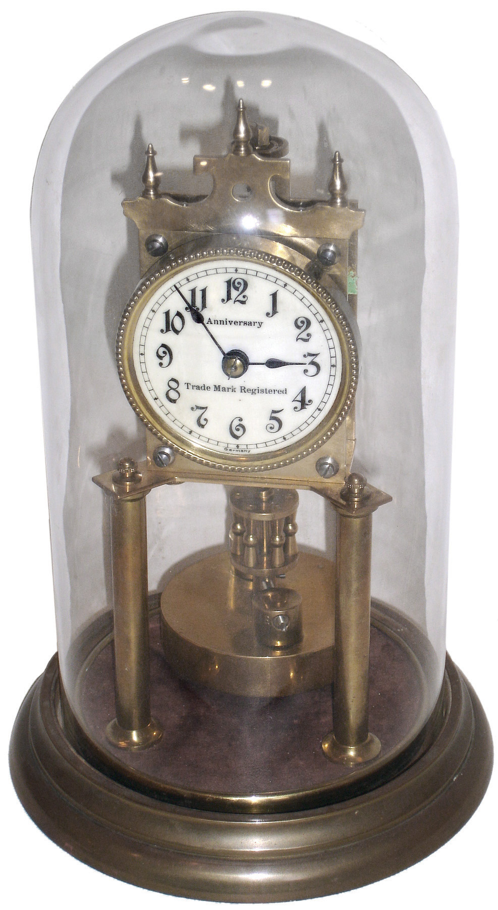 Clocks- 5 (Five), four ÒAnniversaryÓ German 400 day disk pendulum mantel clocks and an electric: (1) Ludwig Hakenjos, Triberg, c1920; (2) unsigned c1910; (3) unsigned, marble base and dome, c1910; (4) Gustav Becker, Freiburg, Germany, ÒMedaille DÕOrÓ stamp and glass dome, c1910; (5) Electric brass and glass mystery clock, Synchron plug-in motor in base, unsigned, c1960 — Antique Clocks Price Guide