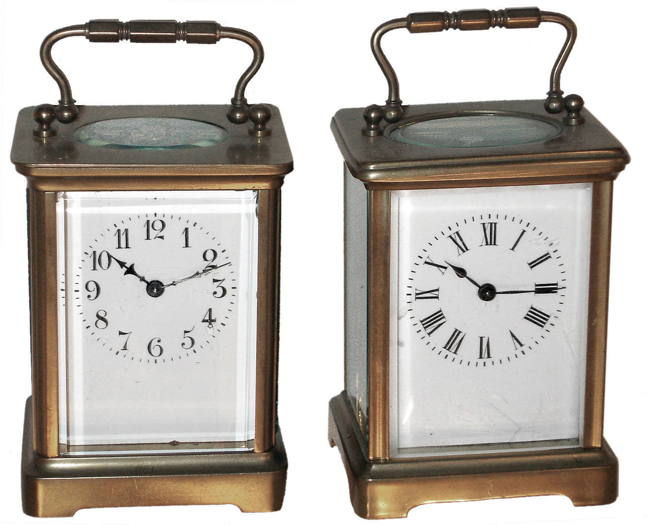 Clocks- 4 (Four) brass and glass carriage clocks, c1900: (1) Two French, 8 days, time only; (2) Two Waterbury 30 hours, smaller one is the ÒMidgeÓ, larger is ÒConductorÓ with alarm — Antique Clocks Price Guide