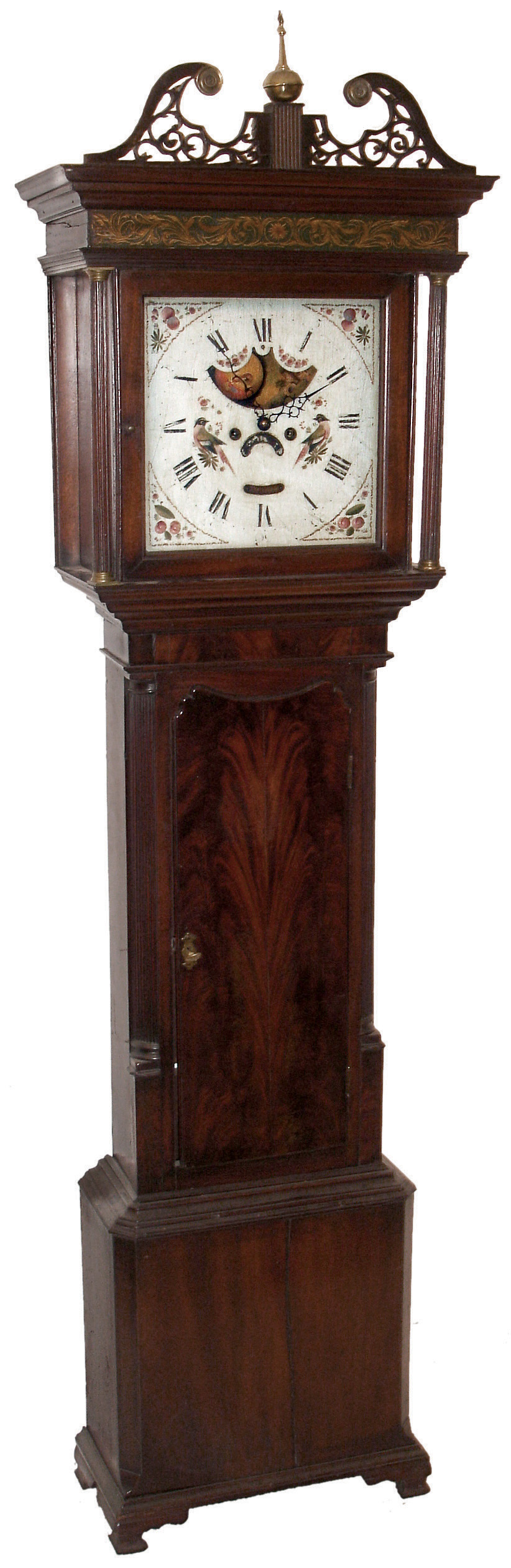 R. Clayton, English tall clock, 8 days, time, strike and calendar, weight driven movement in a mahogany case with crotch veneer door, reeded corner columns flanking trunk door, reeded full columns flanking hood door with gold painted molding above and fretwork broken arch crest. The painted iron square dial has moon phase and is decorated with two birds, c1830 — Antique Clocks Price Guide