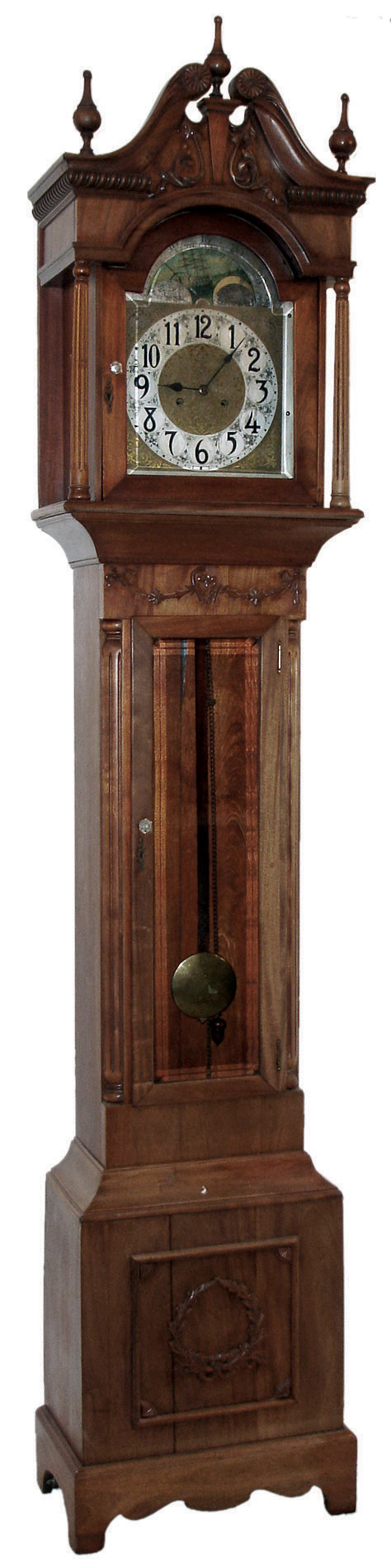 New Haven Clock Co., New Haven, Conn., ÒSherbrookeÓ, tall case clock, 8 days, time, strike and chime, weight driven, ladder chain movement in a mahogany case with beveled glasses, broken arch top, applied carvings and brass dial with silvered chapter ring, c1911 — Antique Clocks Price Guide