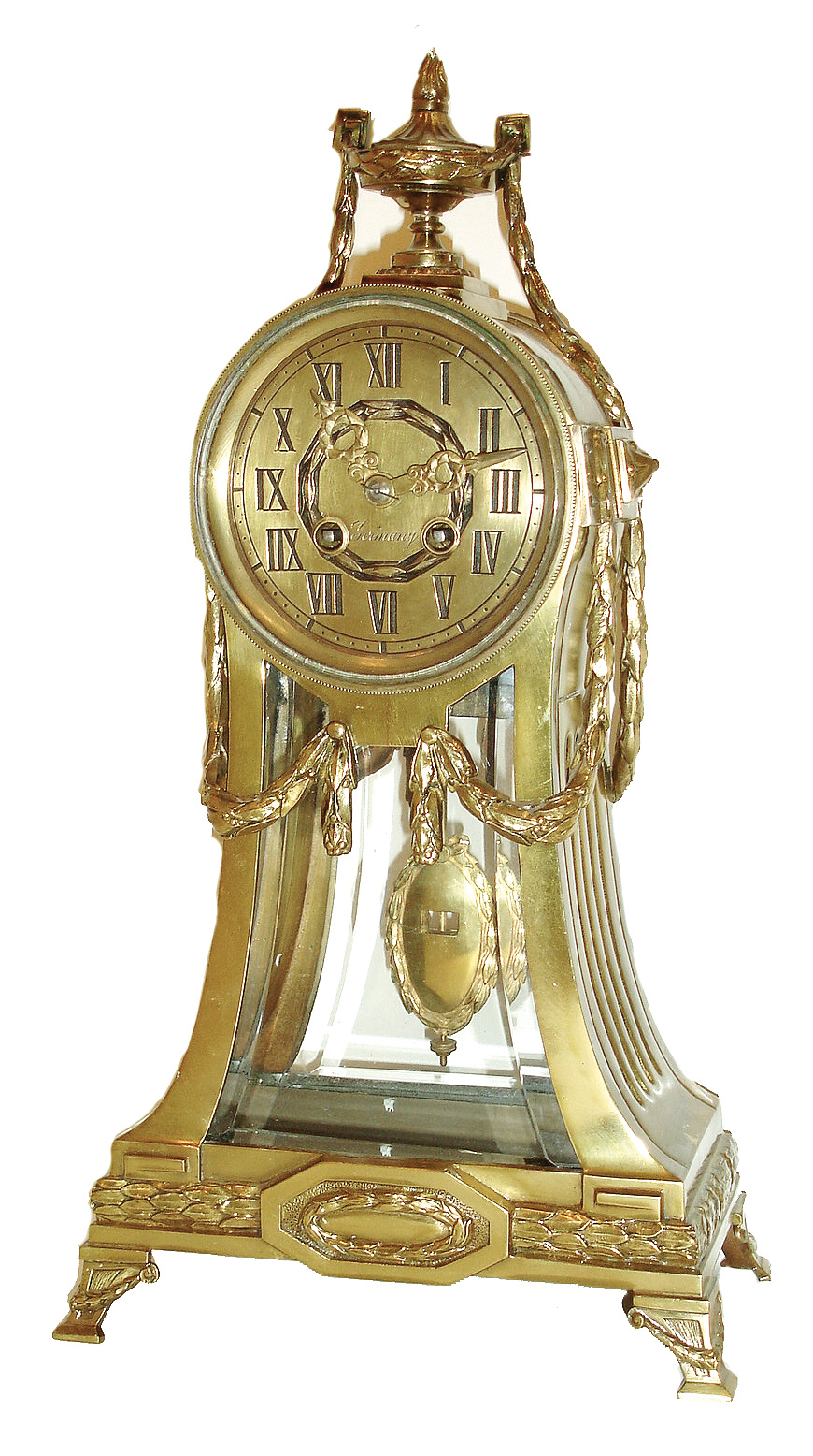 Lenzkirch, Germany, shelf clock, brass case with fluted, incurved sides and round top, decorated with laurel festoons and moldings, back and front set with beveled glasses, Roman numeral brass dial, brass hands, 8 days, time and strike, movement with round plates, in the French style, pendulum with elliptical brass ball, surrounded by a laurel wreath, serial No. 1,733,087, c1915 — Antique Clocks Price Guide