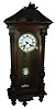 Clocks- 3 (Three) German walnut, 8 days, time and strike, spring driven, wall clocks: two R/A with white enamel dials and pendulum; one with ornate brass dial and pendulum; c1900