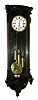 Simon Franklin in Wien, Austria, Vienna regulator, case with rosewood graining, door with scrolled corbels, bowed, fluted top with conforming cavetto cornice, bottom with curved moldings and applied carved drop, signed Roman numeral white enamel dial, pierced blued steel hands, brass, 8 days, 3 train grand sonnerie striking movement, polished brass pendulum and weights, c1860