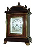 France, a small - miniature desk clock, in the form of an English bracket clock, for the London market, with a good Paris made carriage style platform lever timepiece movement, in a mahogany case with polished brass trim and 5 finials; c1890