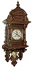 Lenzkirch, Germany, free swinger oak case with turned ornaments and shallow scroll carving, removable top with carved shell and central finial, Arabic numeral silvered dial, pierced, blued steel hands, 8 days, time and strike, movement, gilt pendulum with rococo style ornament and putto, serial No. 1,216,898, c1900