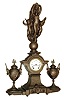 Seth Thomas Sons & Co., New York, NY, ÓNo. 8056Ò figural mantel clock, 15 days, time and half hour strike, spring driven movement in a gold finished spelter case surmounted by a female figure with arms raised flanked by two Putti resting on a base with two fancy urns with a white enamel dial, c1872