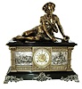 Ansonia Clock Co., New York, NY, ÒColumbiaÓ figural shelf clock, 8 days, time and strike, spring driven movement with decorated rear plate. Enameled cast iron case with applied cast friezes depicting Medieval military scenes resting on large cast brass front feet surmounted by a spelter statue of shepard boy reclining and a cream enamel dial with open escapement and cast brass center and bezel, c1890