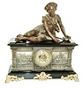 Ansonia Clock Co., New York, NY, ÒColumbiaÓ figural shelf clock, 8 days, time and strike, spring driven movement in a enameled cast iron case with applied cast friezes depicting Medieval military scenes resting on large cast brass front feet surmounted by a spelter statue of shepard boy reclining and a extra fancy cast brass dial with applied Roman numerals and open escapement, c1890
