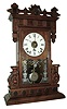 Seth Thomas Clock Co., Thomaston, Conn., ÓBeloitÒ model city series mantel clock with spring driven, 8 days, time, strike and alarm movement in a walnut case, c1885.