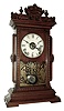 Seth Thomas Clock Co., Thomaston, Conn., ÓUticaÒ model city series mantel clock with spring driven, 8 days, time, strike and alarm movement in a walnut case, c1887.