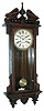 Waterbury Clock Co., Waterbury, Conn., ÒEtonÓ wall hanging clock with a spring driven, 8 days, time and strike, movement in an oak case, c1906.