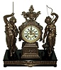 Ansonia Clock Co., New York, NY, ÒFisher and HunterÓ double statue figural shelf clock, 8 days, time and strike, spring driven movement with a Japanese Bronze finished spelter case on an enameled cast iron base with applied cast Japanese Bronze finished friezes, cream enamel dial with open escapement, c1894