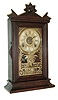 Clocks- 3 (Two) American: (1) E. Ingraham & Co., Bristol, Conn., ÓAcmeÒ shelf clock in a walnut case with a spring driven, 8 days, time, strike and alarm movement, c1882; (2) Seth ThomasÕ Sons & Co., New York, No. 5001 model time and bell strike candle stand clock, less dome (3) Ansonia Clock Co., Ansonia, Conn., ÓCoralÒ, 8 days, time and strike, spring brass movement crystal regulator mantel clock, c1914
