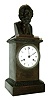 French, unsigned, heavy bronze mantle clock, tribute to Euclid and surmounted by a finely detailed bust of his likeness, the porcelain dial signed LAGUESSE, aÕ PARIS, c1830.