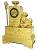 France, Ormolu figural clock showing a dog and child, after playing a form of bilboquette, the clock contained within tower to left, and with paddle and ball catcher showing left side, c1825