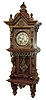 Lenzkirch, Germany, walnut open well or ÓFreischwingerÒ, with built-in top and with approx 24 pieces of brass decoration, and the fancy cast pendulum depicting a lionÕs head, the well made movement bearing the Lenzkirch logo and serial Nr. 860461, Fancy embossed brass dial with gilt highlights, c1888