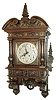 Lenzkirch, Germany, Gutsherrenuhr style No. 63, in walnut {Nussbaum], this model well documented in Mr. EverettÕs Lenzkirch book, page 148, and with a full color photo in Ó150 Jahre Lenzkircher UhrenÒ, page 155. This was among the most elaborate models produced. 8 days, time and Quarter strike, Serial Nr. 1,050,538 Note that all 3 obelisk finials are profusely decorated. Old patina and finish, nicely waxed, c1895