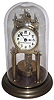 Clocks- 5 (Five), four ÒAnniversaryÓ German 400 day disk pendulum mantel clocks and an electric: (1) Ludwig Hakenjos, Triberg, c1920; (2) unsigned c1910; (3) unsigned, marble base and dome, c1910; (4) Gustav Becker, Freiburg, Germany, ÒMedaille DÕOrÓ stamp and glass dome, c1910; (5) Electric brass and glass mystery clock, Synchron plug-in motor in base, unsigned, c1960