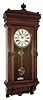 Waterbury Clock Co., Waterbury, Conn., ÓLeedsÒ wall hanging clock in a walnut case with a spring driven, 8 days, time and strike, movement, c1893