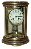 A.D. Mougin, French, 8 days, time and strike, spring brass movement oval brass and glass crystal regulator shelf clock with champleve enamel, c1900