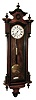 Gustav Becker, Germany, Vienna regulator, walnut case with glazed front and sides, with ebonized moldings and finials, Roman numeral white enamel dial with seconds bit, pierced, blued steel hands, 8 days, weight driven, timepiece movement, the back plate signed ÓGustav Becker Freiburg/SÒ and with crown and anchor logo, brass pendulum ball on an ebonized wooden rod, c1890