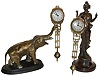 Clocks- 2 (Two) Asian reproduction cast metal small, 8 days, swingers on wood bases: Diana and elephant; late 20th century