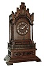 Germany, large shelf cuckoo, the Gothic inspired oak case of architectural form, with castellated parapet above a molded arch with applied, pierced carvings, supported by slender twist turned (barley twist) columns at the corners. The Roman numeral, turned wooden dial with carved hands, all on a rectangular base with carved, recessed panels, ogee molding, and flat, molded feet, 8 days, two train fusee movement striking on a gong assisted by the painted wooden cuckoo, c1860