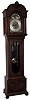 Herschede Clock Co., Cincinnati, Ohio, 8 days, time, strike and triple brass, weight driven, German movement with Westminster chimes on six tubes. Mahogany case with beveled trunk glass, carved top and bun feet. Brass dial with silvered chapter ring and moon phases, c1910