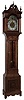 New Haven Clock Co., New Haven, Conn., ÒSherbrookeÓ, tall case clock, 8 days, time, strike and chime, weight driven, ladder chain movement in a mahogany case with beveled glasses, broken arch top, applied carvings and brass dial with silvered chapter ring, c1911