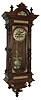 Lenzkirch, Germany, regulator wall clock, 8 days, time and strike, spring driven, series No. 26 movement in an oak case with fourteen pieces of cast brass ornamentation, a brass dial, silvered chapter ring, engraved dial center and fancy cast pendulum bob, serial number 574155, c1881