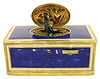 Germany or Switzerland, singing bird box, the surface with blue enamel in imitation of lapis lazuli, each panel bordered with a white enamel band, and with gilt, engraved borders, the top with oval door concealing a bird with brightly colored feathers, appearing and performing on demand, late 20th century