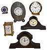 Clocks- 14 (Fourteen): French silver trophy clock ÓAmerican Yacht Club, Second Prize Won By Rascall III, July 3, 1912Ò; Proclocks reproduction small brass carriage clock; miniature wood tambour; Appella small Swiss alarm clock; Bulova round alarm clock; Seth Thomas, 8 days, wood tambour clock; Forum, Shanghai, modern, 8 days, Westminster chime balance wheel clock on simulated burl base with square glass cover, and seven others, all 20th century